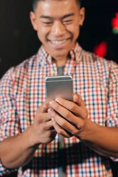 Handsome young man using his mobile. Stock Photos