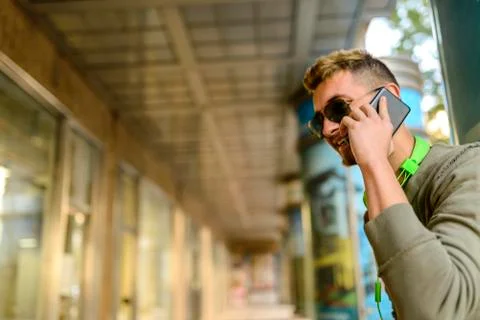 Handsome young man using his phone outdoors Foto stock