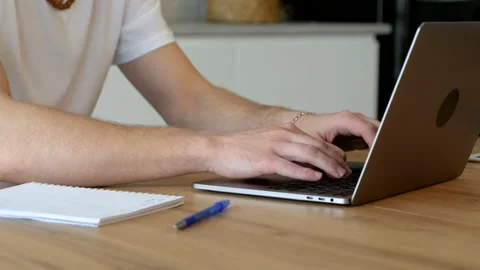 Handsome young man using laptop computer at home. Student men working Stock Footage 171542570