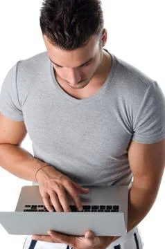 Handsome young man using laptop computer Stock Photos
