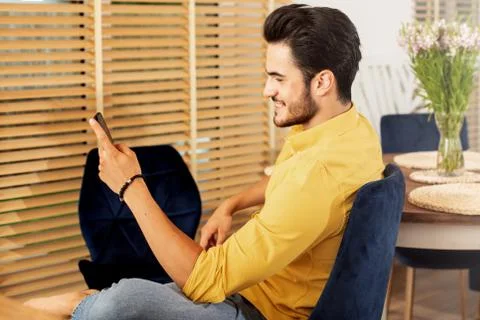 Handsome young man using mobile phone. 스톡 사진