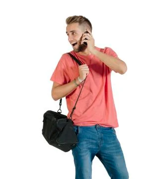 Handsome young man using a smartphone. Stock Photos