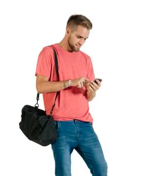 Handsome young man using a smartphone. Stock Photos