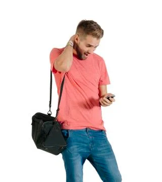 Handsome young man using a smartphone. Stock Photos