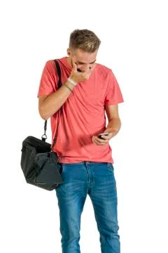 Handsome young man using a smartphone. Stock Photos