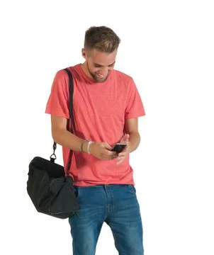 Handsome young man using a smartphone. Stock Photos