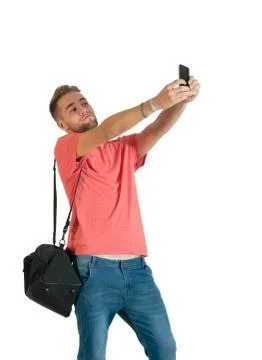 Handsome young man using a smartphone. Stock Photos