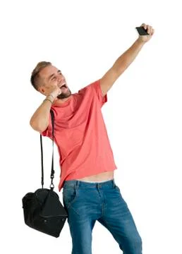 Handsome young man using a smartphone. Stock Photos