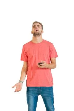 Handsome young man using a smartphone. Stock Photos