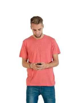 Handsome young man using a smartphone. Stock Photos