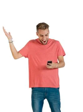 Handsome young man using a smartphone. Stock Photos