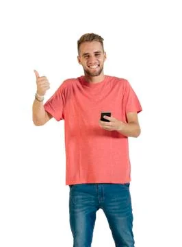 Handsome young man using a smartphone. Stock Photos
