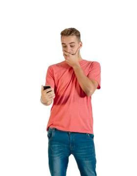Handsome young man using a smartphone. Stock Photos