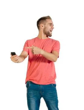 Handsome young man using a smartphone. Stock Photos