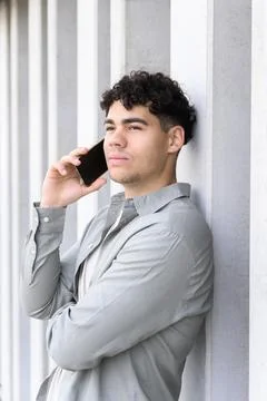 Handsome young man using smartphone Stock Photos