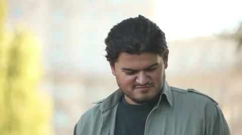 Handsome Young Man w Two Cellphones Stock-Footage 8660334