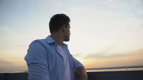 Handsome young man watching sunset from terrace, thinking about life, problems Stock-Footage 117215959