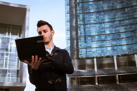 Handsome young man working at computer Stock Photos
