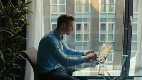 Handsome young man working with laptop, indoors. 動画素材 86237600