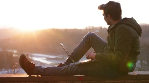 Handsome young man working on laptop Stock Footage 101432982