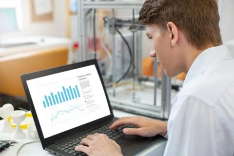 Handsome young man working on presentation Stock Photos