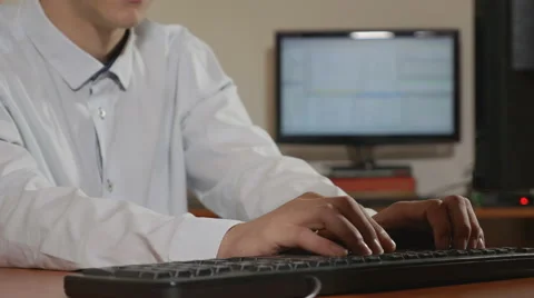 Handsome young programmer bending over and looking into the camera Stock Footage 58958129