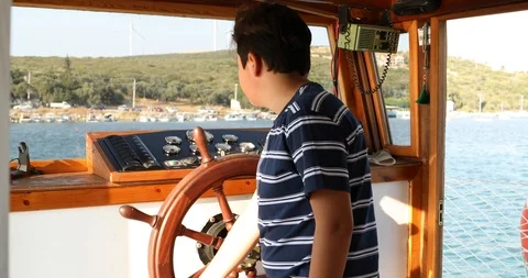 Handsome young sailor at the helm 3 Stock Footage 114955699