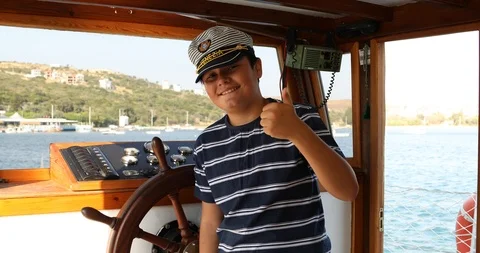 Handsome young sailor at the helm 5 Stock Footage 114956717