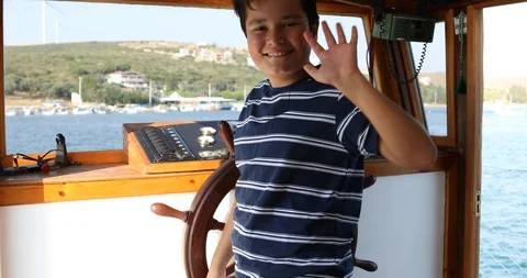 Handsome young sailor at the helm Stock Footage 114961145