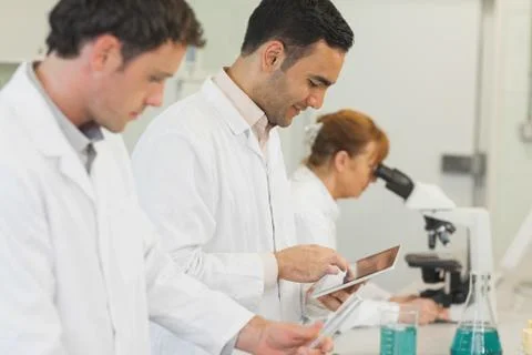 Handsome young scientist using his tablet Fotos Stock