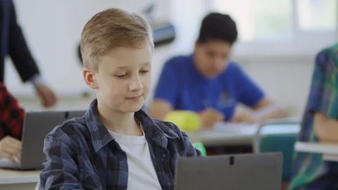Handsome young student boy surfing social networks during a computer science Stock Footage 111969321