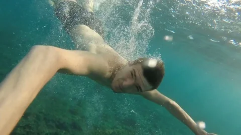 Handsome Young Swimmer Diving Underwater Diver Sun Rays Water Tropical Location Stock Footage 80259208
