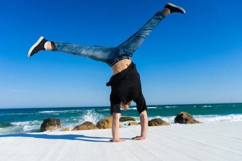Handstand at the beach Stock Photos