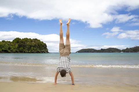 Handstand on the beach 스톡 사진