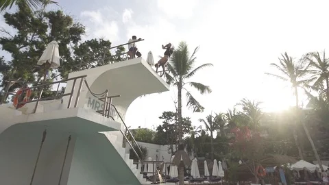 Handstand Cast Flip at Bali Pool Club Slow Motion Stock Footage 106151435