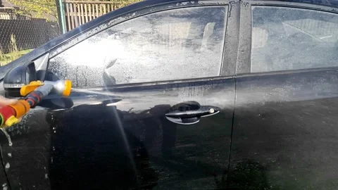 Handwashing a car in a rural setting Stock Footage 252948546