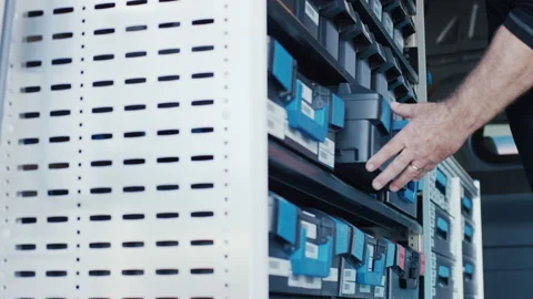 Handworker reaching for tool box in organized mobile workshop van storage system Video stock 155208209