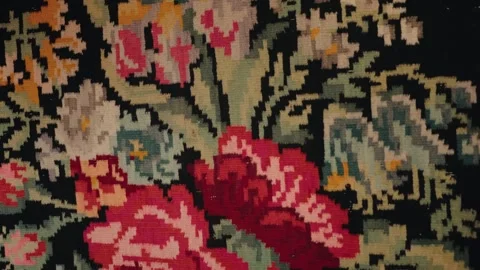 Handwoven antique rug with floral pattern and black background Stock Footage 345898778