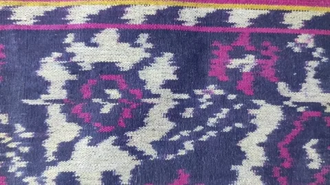 Handwoven material with abstract red and yellow flowers ornament Stock Footage 264157111
