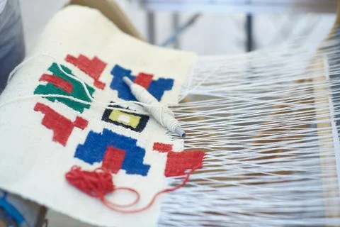 Handwoven Wool Textile with Geometric Patterns on Loom Stock Photos