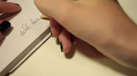 Handwriting in diary. With love. Stock Footage 54949910