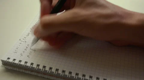 Handwriting math formulas in exercise book closeup time lapse 4k UHD (3840x2160) Stock Footage 65682077