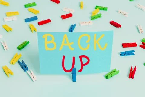 Handwriting text Back Up. Concept meaning saving important data into internet Stock Photos