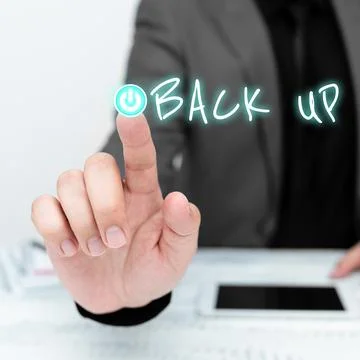 Handwriting text Back Up. Concept meaning saving important data into internet Stock Photos