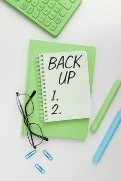 Handwriting text Back Up. Internet Concept saving important data into internet Stock Photos