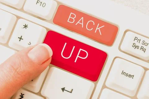 Handwriting text Back Up, Word for saving important data into internet cloud  Stock Photos