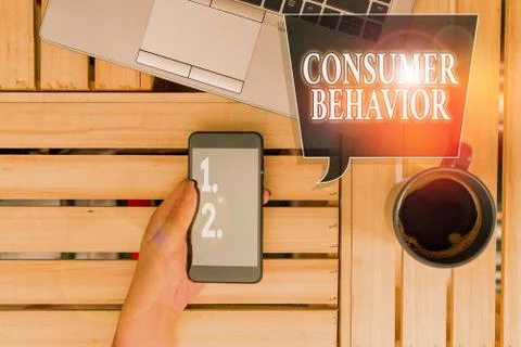 Handwriting text Consumer Behavior. Concept meaning study of how individual Stock Photos