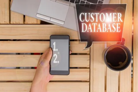 Handwriting text Customer Database. Concept meaning uptodate on customer Stock Photos