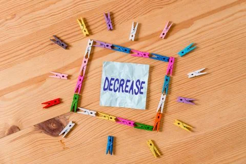 Handwriting text Decrease. Concept meaning the process of growing progressively Stock Photos