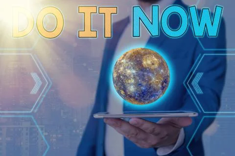 Handwriting text Do It Now. Concept meaning not hesitate and start working or Stock Photos